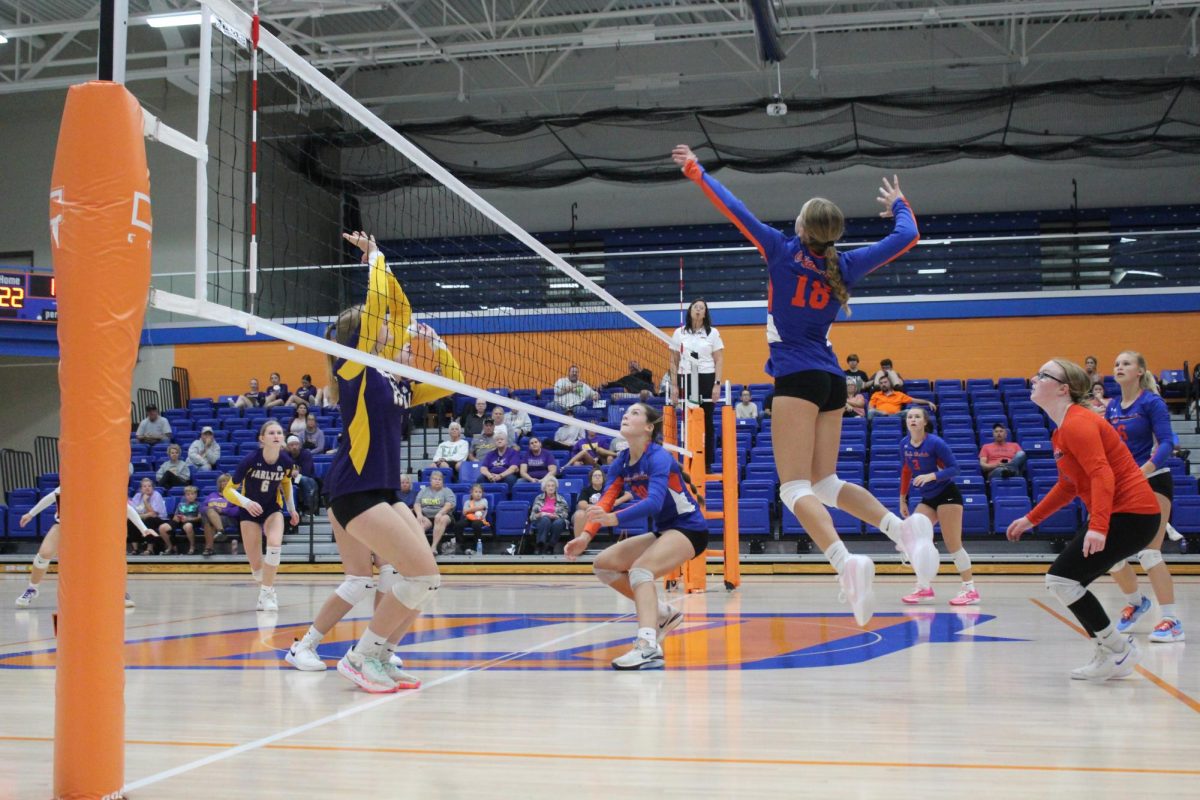 Alyssa Statler spikes the ball in a game against Carlyle.