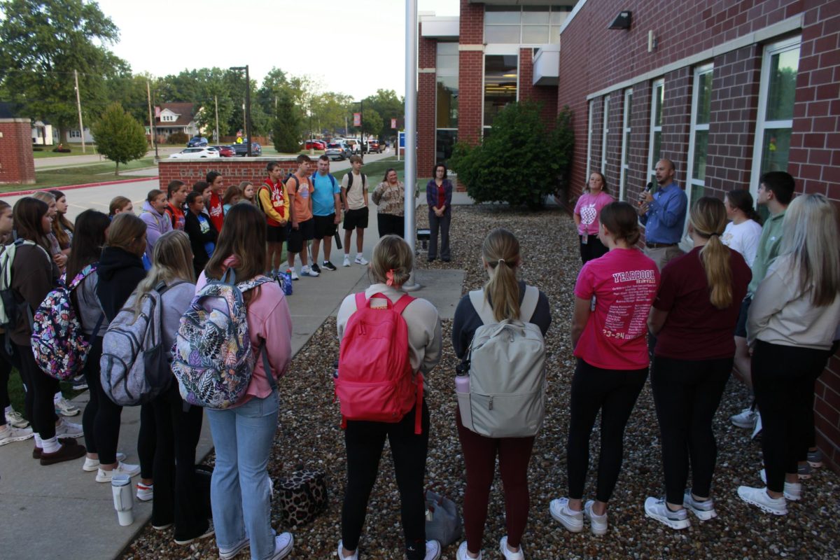 FCA members gathered around the pole.