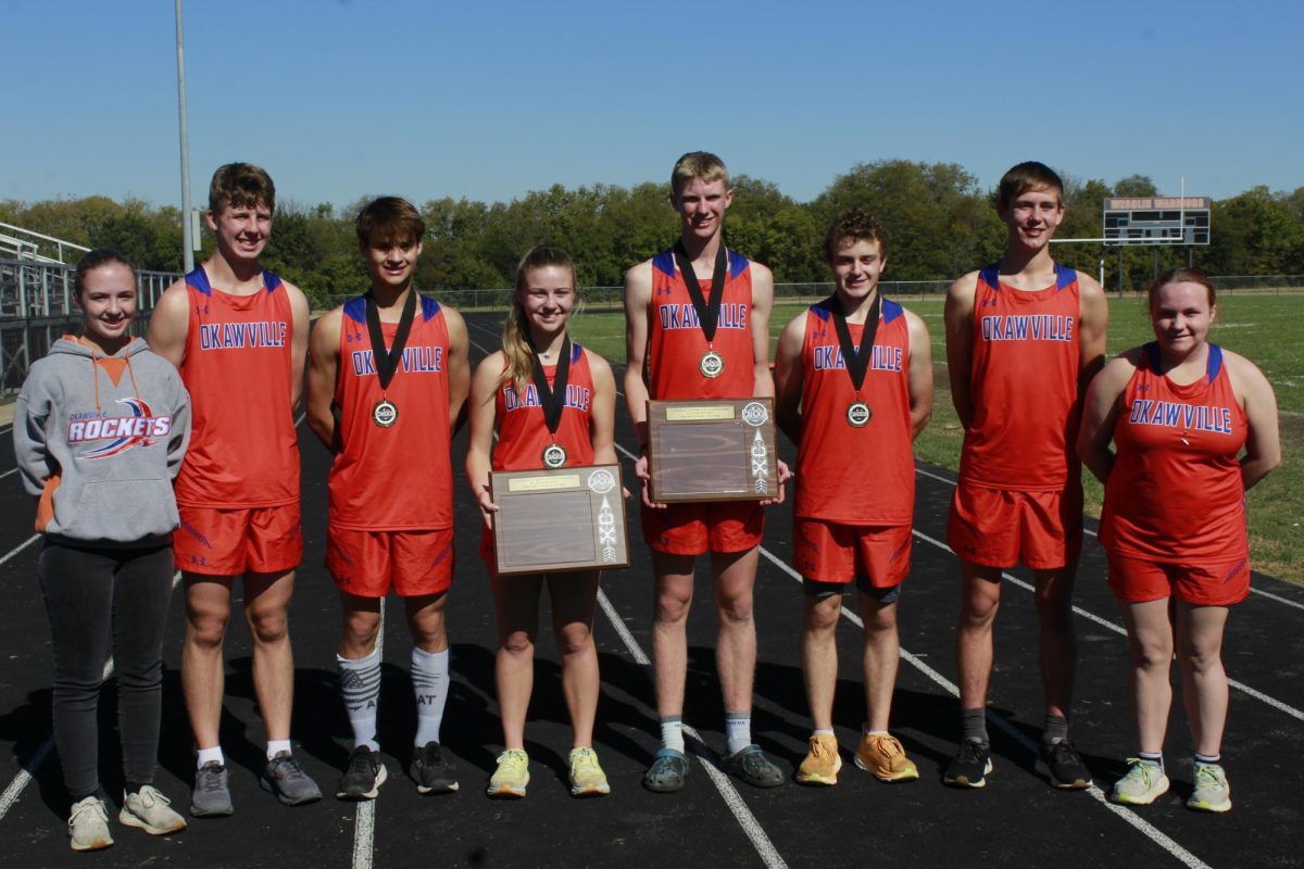 XC Seniors with their Cahokia Conference plaques after the Boys' & Girls' placed first place.