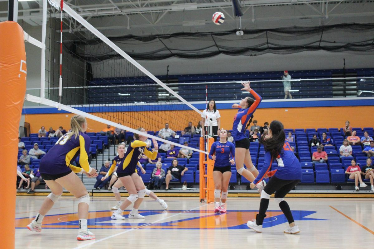 Jaycie Buss hitting middle during the game against Carlyle.